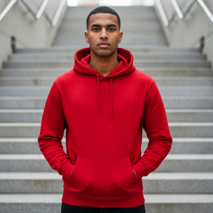 Male model wearing a red hoodie standing on the stairs. Plain Red Hoodie by Paryatak Travel Shop.